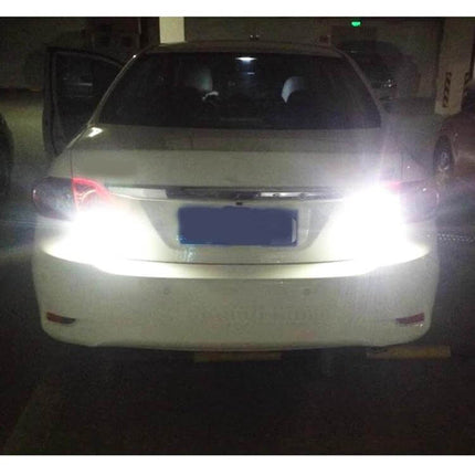 Car Turn and Reversing Light With Projector Lens 2 Pack installed on rear of sedan showing bright illuminated reversing lights