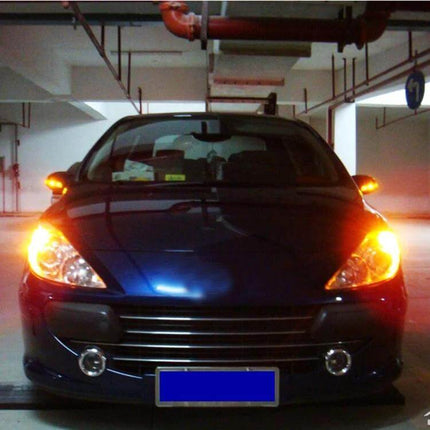 Ceramic T20 Car Turn Signal Light For Daily Driving installed on front of parked blue car with amber signals illuminated