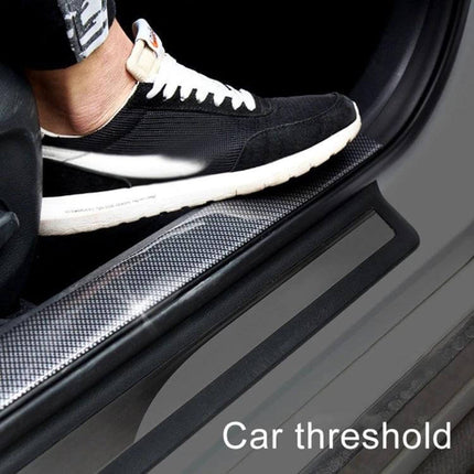 Black 3cm x 3m Universal Car Door Threshold Decoration Strip installed on car door sill protecting against scuffs