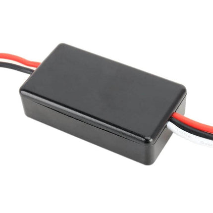 Universal Car LED Running Light With Remote Control compact black control module with red and black wiring