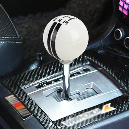 Universal Resin Ball Gear Shift Knob for Manual Vehicles installed on car center console showing white resin ball with black stripe