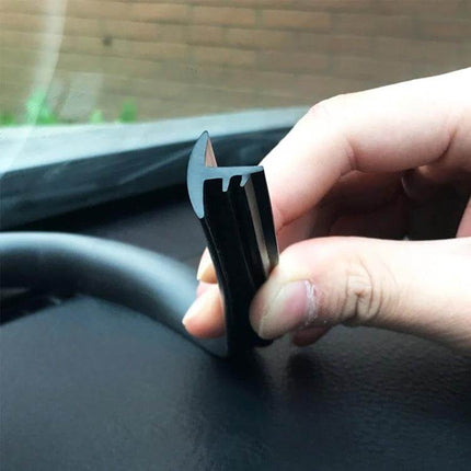 Flexible Chrome Decorative Strip for Car Dashboards, 1.5m Long held over dashboard showing flexible profile and edge fit