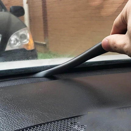 Flexible Chrome Decorative Strip for Car Dashboards, 1.5m Long installed along dashboard edge being pressed into place