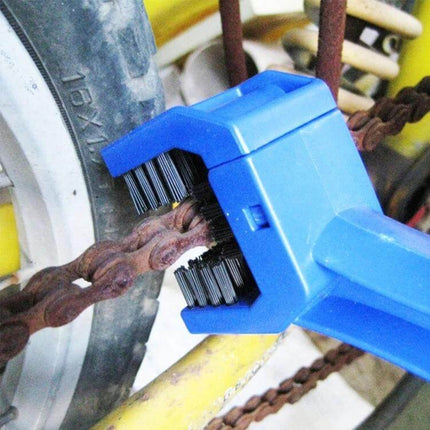 Blue Nylon Chain Cleaning Brush for Motorcycles and Bikes cleaning a rusty bike chain with durable nylon bristles