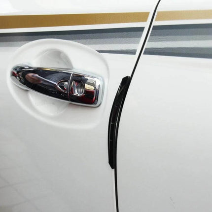 Set of 4 Black Rubber Car Side Door Edge Protection Guards fitted on white car door near chrome handle, protecting against dings and scratches