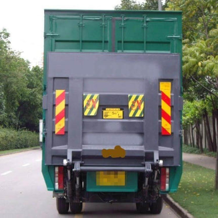 Aluminum Rear Warning Sign Sticker for Trucks and Vans, 55cm x 13cm on rear of green truck for improved visibility in low light