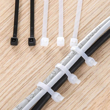 Nylon Cable Ties 5mm x 300mm, 250 Pack, Black, General Use - black and white cable ties bundling cables on wood surface