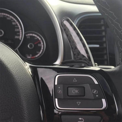 Paddle Shift Extensions for Volkswagen Golf and Passat Driving installed on steering wheel for improved gear shifting accessibility