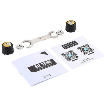 Bluetooth Tire Pressure Monitor for Motorcycles with App and Sensors showing two sensor caps, wrench, nuts and app QR code manual