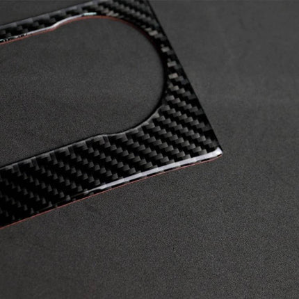 Carbon Fiber Decorative Sticker with German Flag for Mercedes C Class on black textured background close-up showing carbon fiber weave