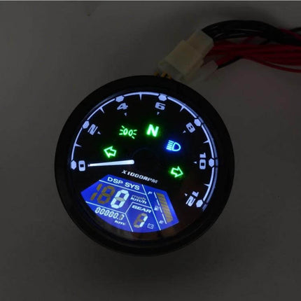 Digital LCD Gauge for Motorcycle Speed and Odometer showing illuminated speed, RPM dial, indicator lights and odometer on a black ABS housing