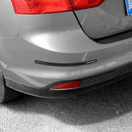 Universal Silicon Car Door Anti-Collision Strip, 4 Pieces - close-up of black silicon bumper strip protecting rear bumper from scratches and dings