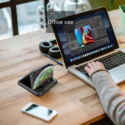 Carbon Fiber Texture Silicone Car Phone Holder for Smartphones displayed on a desk beside laptop for office use, holding smartphone securely