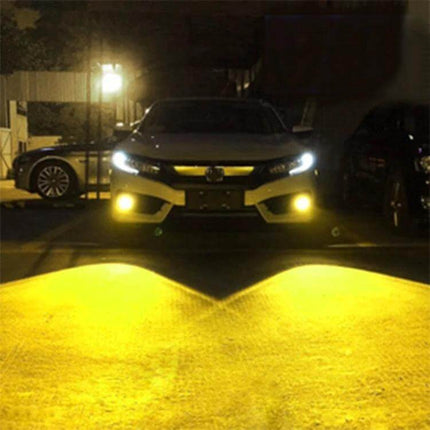 Car LED Fog Light 2-Pack for Easy Night Driving on Wet Roads — front view of car with yellow fog beams illuminating wet pavement