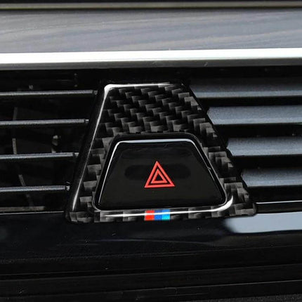 Tricolor Carbon Fiber Warning Light Sticker for BMW 5 Series on hazard button showing carbon fiber texture with red triangle and tricolor stripe