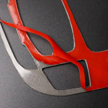 Carbon Fiber Decorative Sticker for Audi Gear Panel applied with red backing film on dark dashboard surface