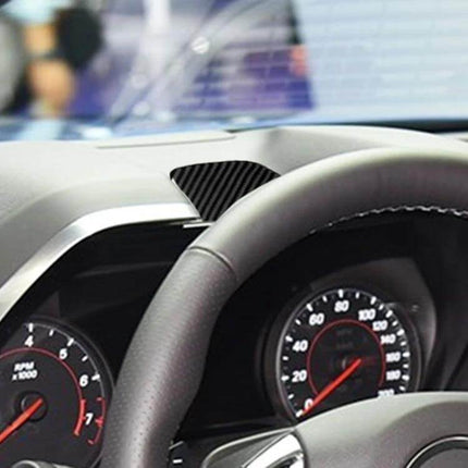 Carbon Fiber Dashboard Sticker for Chevrolet Camaro 2017-2019 installed on dashboard near steering wheel, textured carbon fiber finish