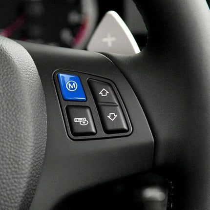 Decorative Wheel M Trim Cover for BMW 3 Series in Blue installed on steering wheel control area showing blue M button accent
