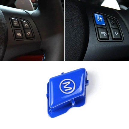 Decorative Wheel M Trim Cover for BMW 3 Series in Blue - blue M button trim installed on steering wheel, close-up of decorative wheel M trim cover