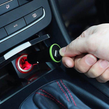 In Car USB C Charger With Stretch Cable For Everyday Charging plugged into 12V car outlet with hand holding compact USB-C stretch cable
