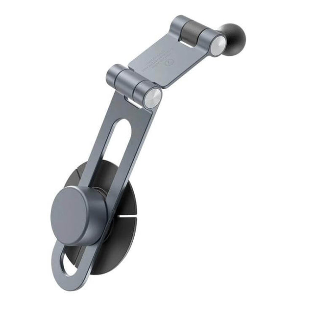 MOMAX Invisible Aluminum Folding Universal Device Mount attached to car dashboard showing compact foldable holder