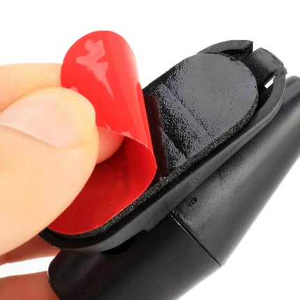 Wind Powered Deer Alert Repeller For Cars, Pair, Black - close-up of black wind-powered deer whistle with adhesive pad being peeled off