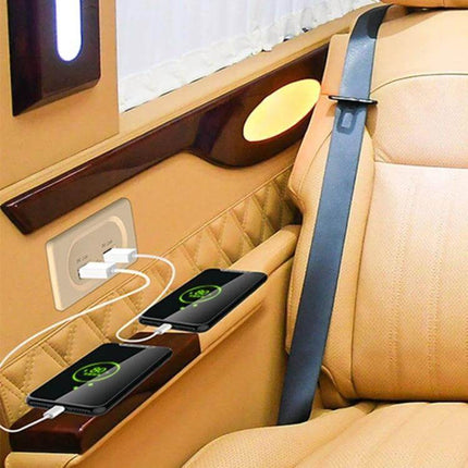 Compact Dual USB Car Charger For RV And Bus Charges Two Devices plugged into RV interior panel charging two smartphones with blue power indicator