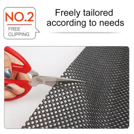 Versatile Car Anti-Slip Mat, 150x50cm for Securing Trunk Items showing scissors cutting PVC foam non-slip mat to custom fit dashboards and trunks