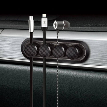 Carbon Fiber Magnetic Desk Cable Organizer for Storage mounted on metal surface holding three cables with carbon fiber texture