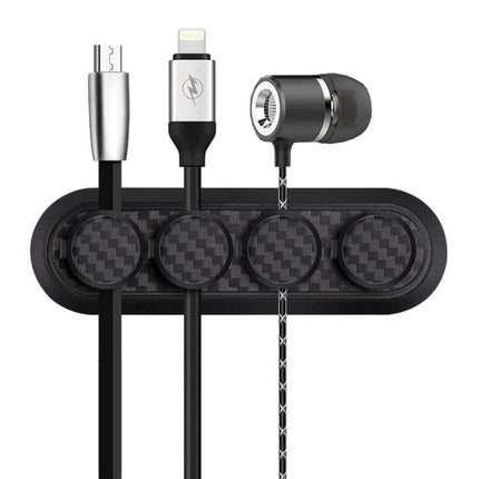 Carbon Fiber Magnetic Desk Cable Organizer for Storage with four magnetic buckles holding charging and audio cables on carbon fiber base