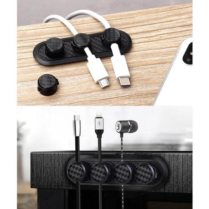 Carbon Fiber Magnetic Desk Cable Organizer for Storage shown holding multiple charging cables on a wood desk with carbon fiber texture