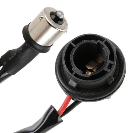 2 Pack LED Turn Signal Light Decoder With Dual Resistance plug-and-play 12V wiring adapter close-up of socket and bayonet connector