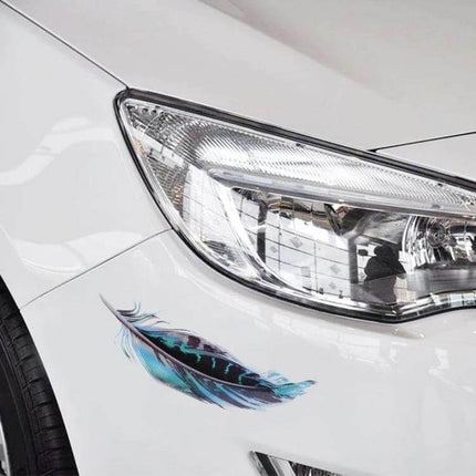 Decorative Feather Stickers for Car and Motorcycle Bodies applied near headlight on white car, blue feather PET decal