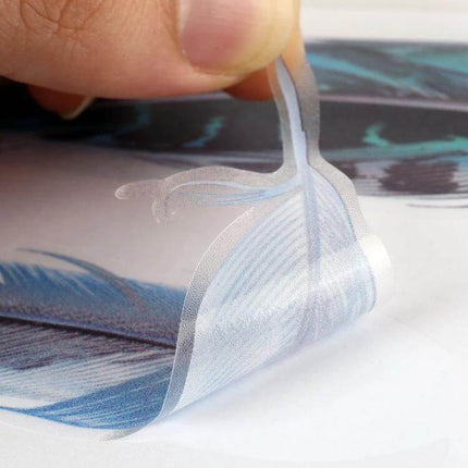 Decorative Feather Stickers for Car and Motorcycle Bodies shown being peeled from backing, blue feather PET decal for vehicle customization