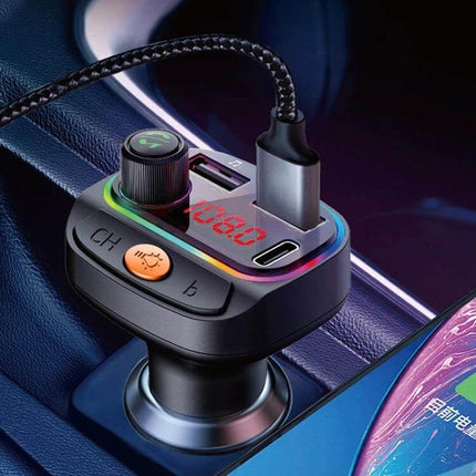C15 Car Bluetooth FM Transmitter With Atmosphere Light plugged into car cigarette lighter showing LED display, dual USB ports and RGB atmosphere ring