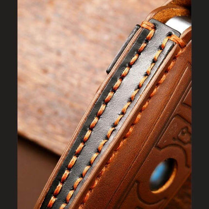 Hallmo Cowhide Leather Protective Key Cover for BMW Keys - close-up of brown stitched cowhide leather key cover showing textured grip and button cutout