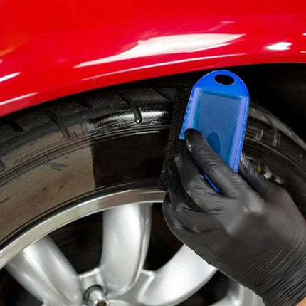 Comfortable Sponge Brush for Car Tire Polishing and Waxing with Cover applying tire polish with gloved hand on black tire and blue sponge brush
