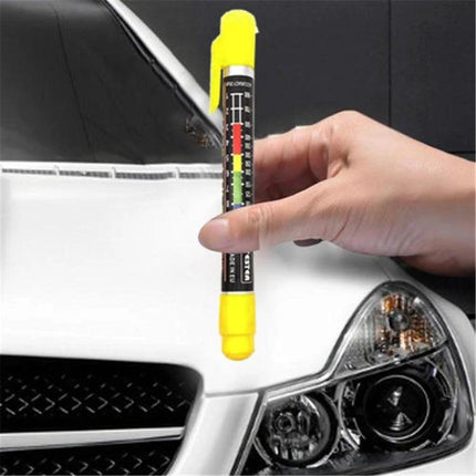 Practical Tool for Everyday Car Paint Inspection Tasks - handheld paint thickness gauge checking white car hood near headlight