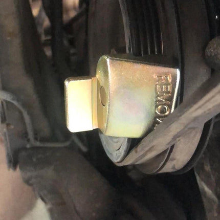 Essential Tool for Car Stretch Belt Maintenance at Home — close-up of pulley tool holding stretch belt for DIY removal and installation