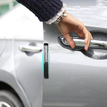 Universal Black Car Door Anti-Collision Protection Strip installed on silver car door near handle to prevent dents and scratches
