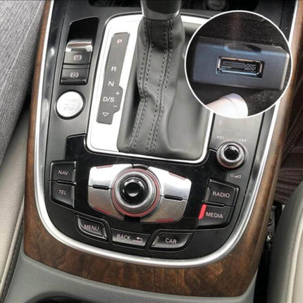 AMI Bluetooth Audio Wiring Harness For Audi Q5 A5 A7 installed in center console showing MMI AUX port for Bluetooth audio streaming and hands-free pairing