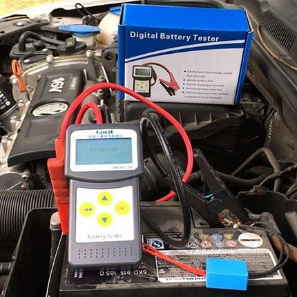 Micro-200 Device For Routine Car Battery Checks At Home handheld battery tester connected to car battery showing cables and display