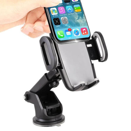 Universal Car Phone Holder with 360-Degree Rotation and Automatic Clamp mounted on dashboard suction cup holding smartphone securely