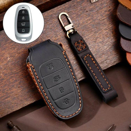 Hallmo Cowhide Leather Key Case for Hyundai 4-Button Keys in black leather with orange stitching and wrist strap, protective slim fit