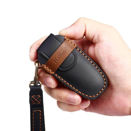 Hallmo Cowhide Leather Key Case for Hyundai 4-Button Keys - black leather protective key fob sleeve with brown trim in hand