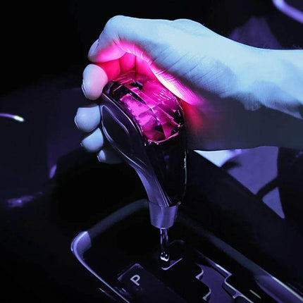 Colorful Crystal USB Charging Gear Shift Knob for Cars glowing pink LED in hand, USB charging port and durable lightweight design