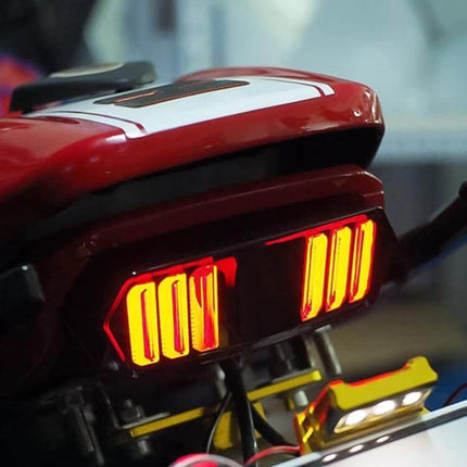 Motorcycle Tail Light Brake Lamp for Honda MSX125 with Turn Signals rear LED assembly mounted on red motorcycle seat