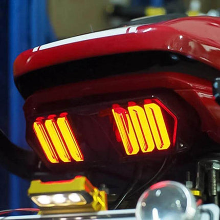 Motorcycle Tail Light Brake Lamp for Honda MSX125 with Turn Signals - illuminated red LED tail light assembly on rear of red motorcycle