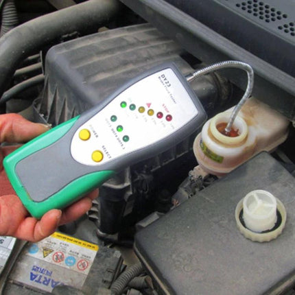 DUOYI Brake Fluid Tester for Everyday Vehicle Checks handheld tester inserted into brake fluid reservoir with folding probe
