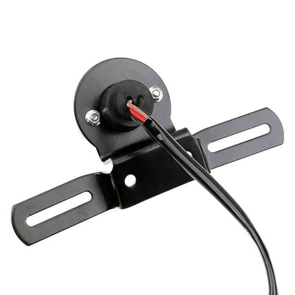 Retro Round Motorcycle Brake Light with License Plate Holder mounted on black bracket showing wiring and license plate slots